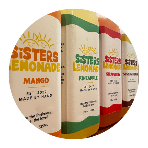 Sisters Lemonade botttles line upi with Mango, Pineapple and Strawberry and Sisters Palmers.
